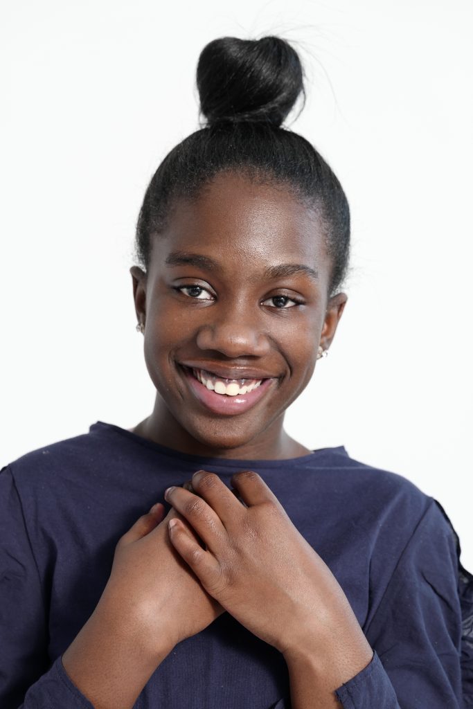 a young girls smiling for a photo